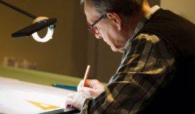 Employee drafting a sketch